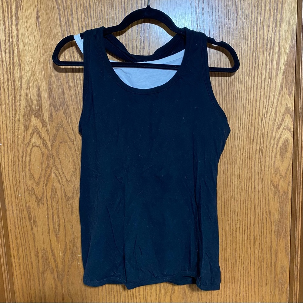 Black Sleeveless razor back tank top with a white Half shirt